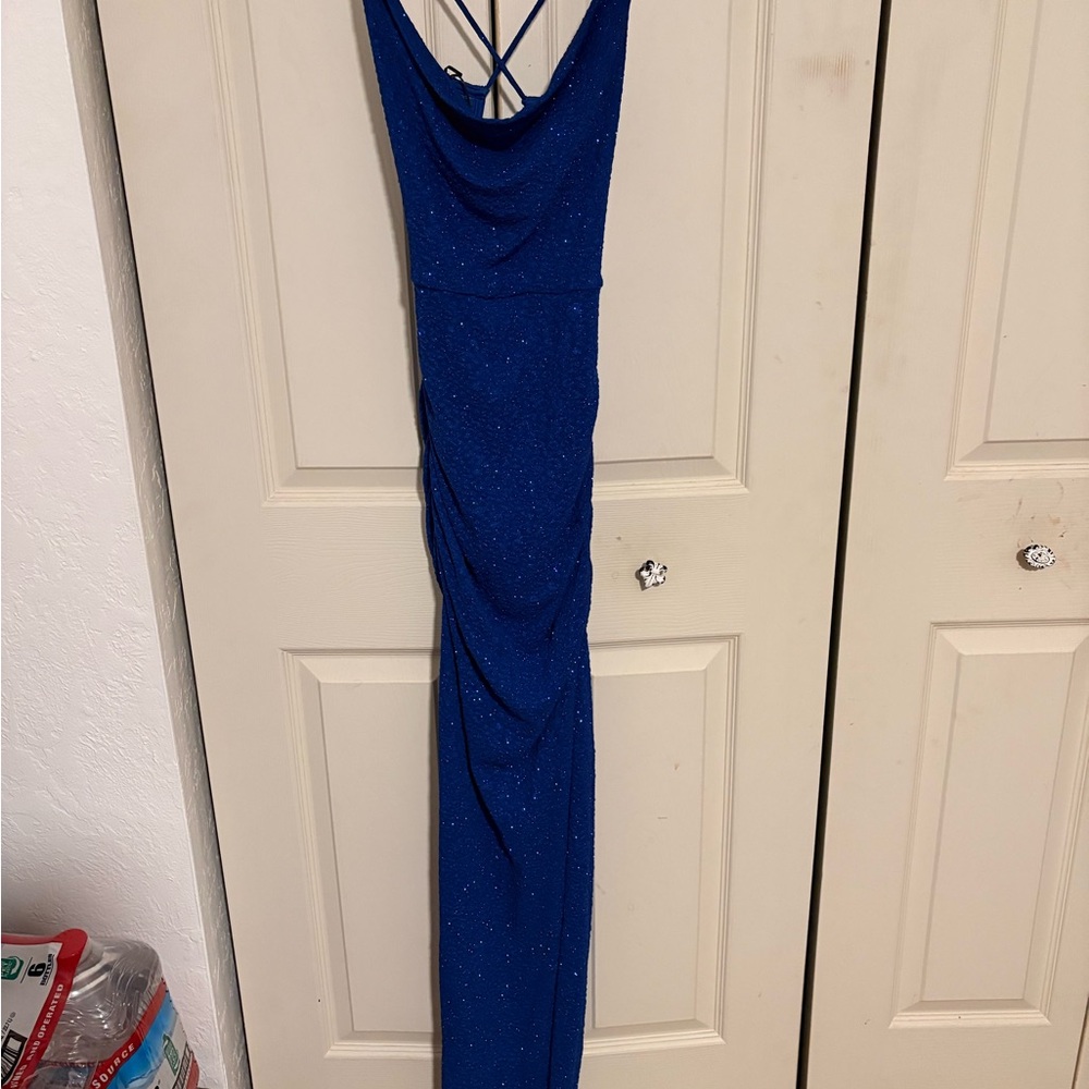 Windsor Shimmering Blue Backless Gown With a Leg Slit